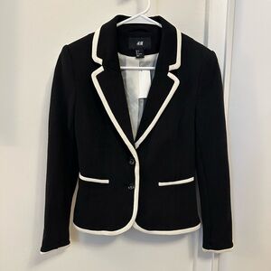 Black fitted blazer with white piping